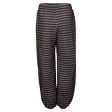 Black and white pied de poule pants with knee patches